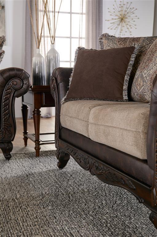 Elmbrook - Upholstered Rolled Arm Loveseat - Brown